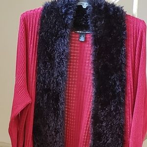 Sweater with black faux fur around collar